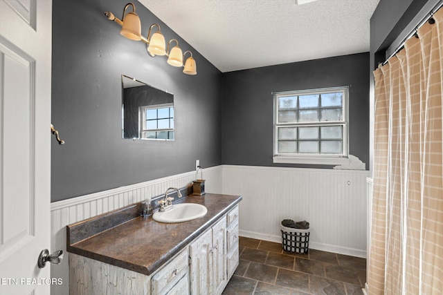 bathroom with vanity and a textured ceiling