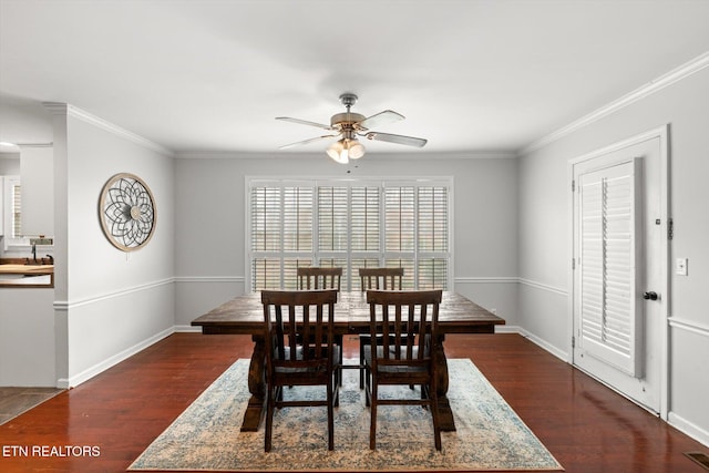 dining room with crown molding, dark hardwood / wood-style flooring, and ceiling fan