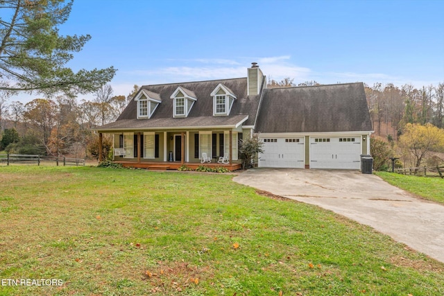 new england style home featuring a garage, covered porch, and a front yard