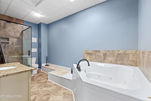 full bathroom featuring separate shower and tub, a paneled ceiling, vanity, and toilet