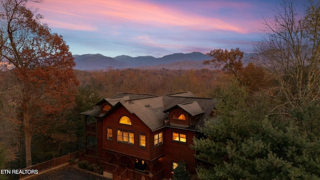 back house at dusk featuring a mountain view