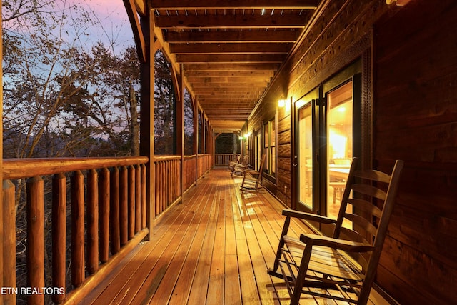 deck at dusk with a porch