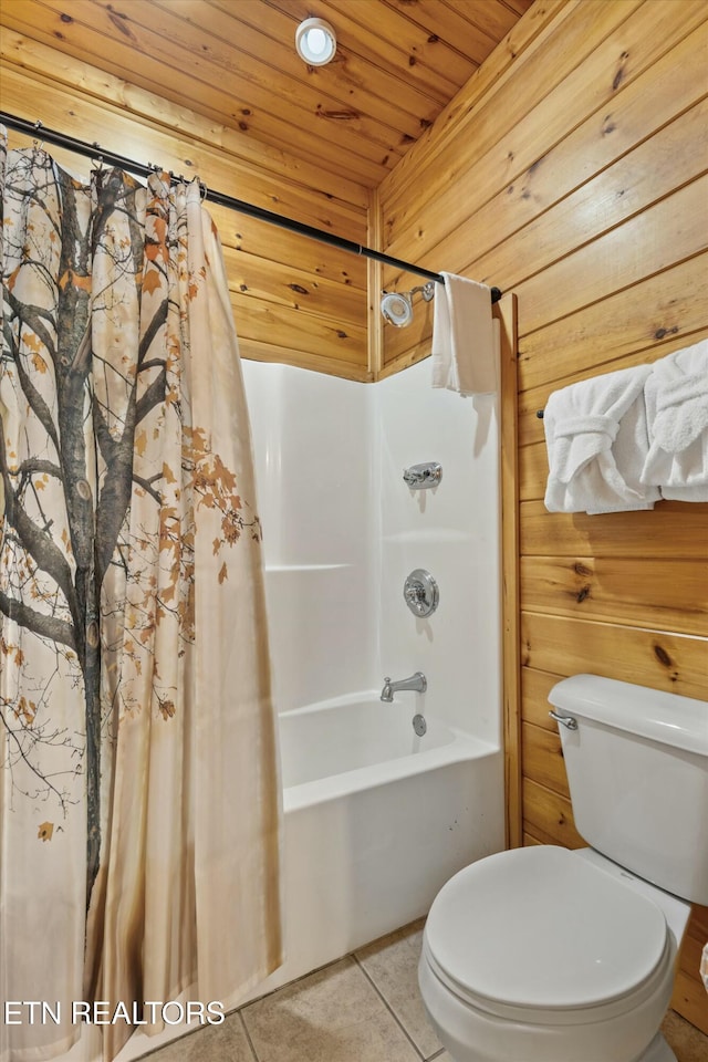 bathroom with tile patterned floors, wooden walls, shower / bathtub combination with curtain, wooden ceiling, and toilet