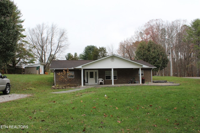 single story home with a porch and a front lawn