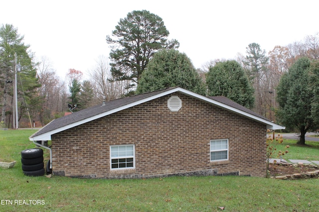 view of property exterior with a lawn