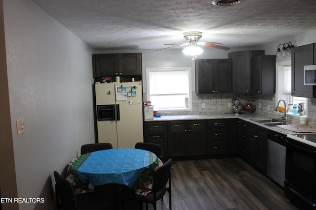 kitchen featuring dishwasher, dark wood-type flooring, sink, decorative backsplash, and white fridge with ice dispenser