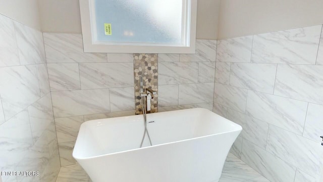 full bath featuring tile walls and a soaking tub