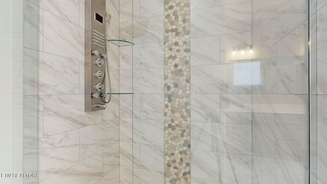 bathroom with a tile shower