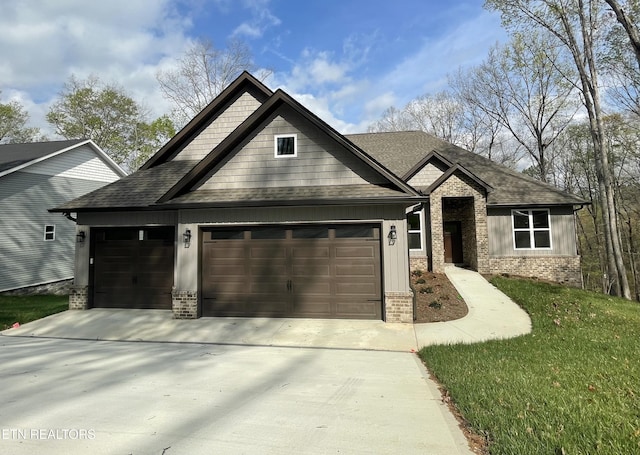 craftsman-style home featuring a shingled roof, an attached garage, brick siding, and concrete driveway