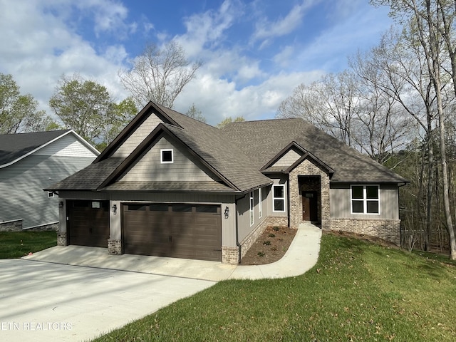 craftsman house with concrete driveway, a front lawn, brick siding, a garage, and a shingled roof