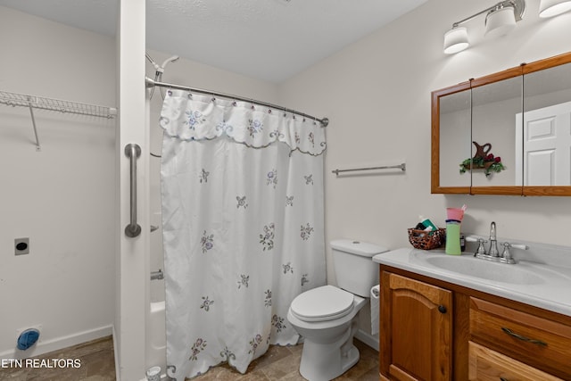 full bathroom with vanity, shower / bath combo, and toilet