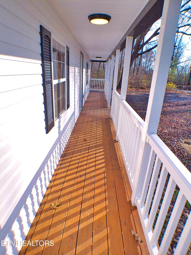 wooden terrace with covered porch