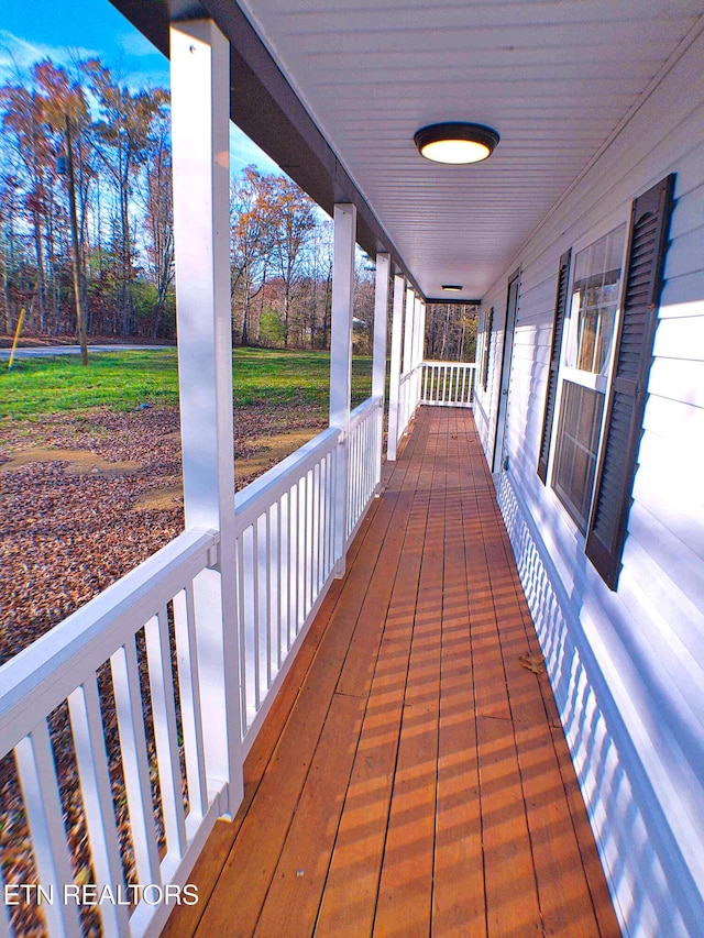 wooden deck featuring a porch