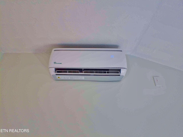 room details featuring a wall mounted AC