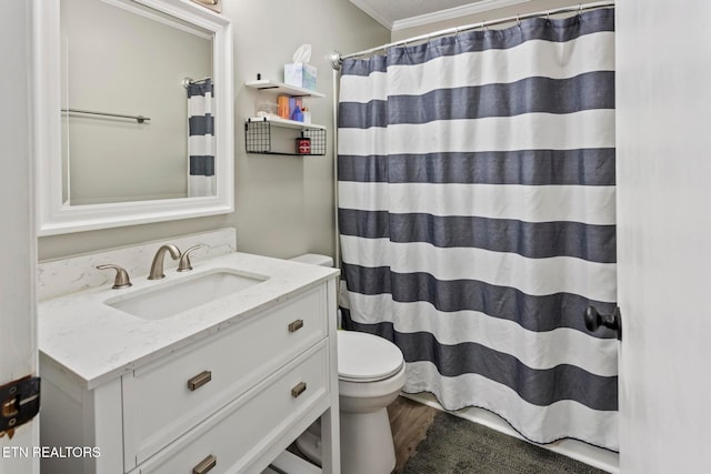 bathroom with a shower with shower curtain, vanity, crown molding, hardwood / wood-style flooring, and toilet