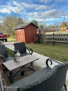 view of patio with a shed