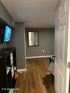 living room with dark hardwood / wood-style flooring