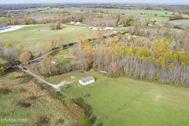 birds eye view of property with a rural view