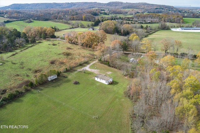 birds eye view of property with a rural view