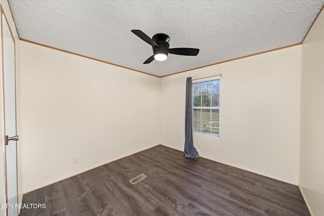 unfurnished room with ceiling fan, dark hardwood / wood-style flooring, a textured ceiling, and crown molding