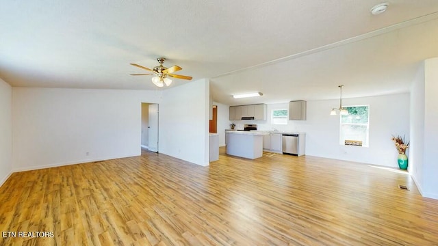 unfurnished living room with ceiling fan and light hardwood / wood-style flooring