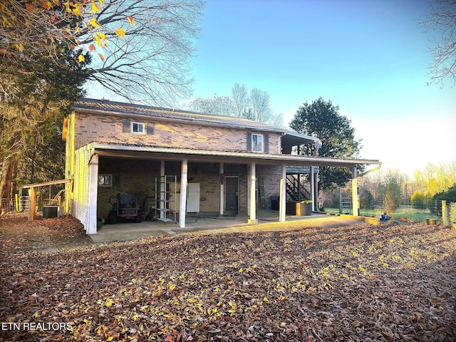 back of house with cooling unit