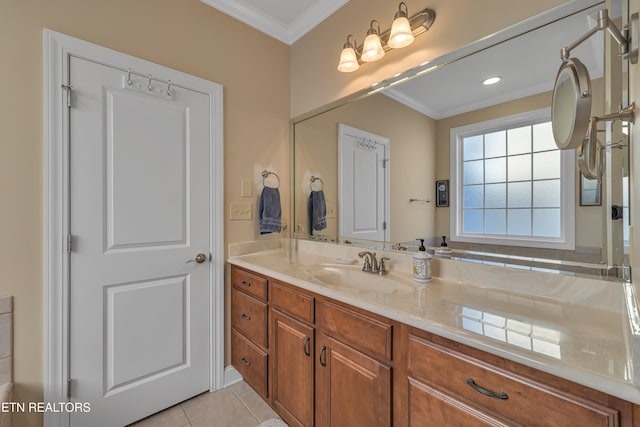 bathroom featuring tile patterned floors, crown molding, and vanity