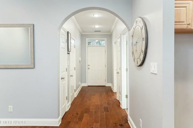 corridor featuring crown molding and dark wood-type flooring