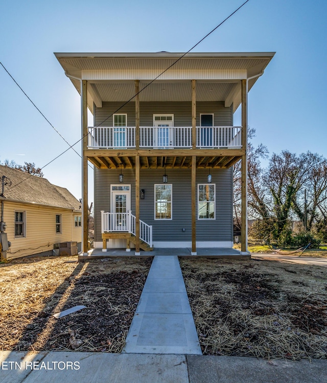 view of front of home with a balcony