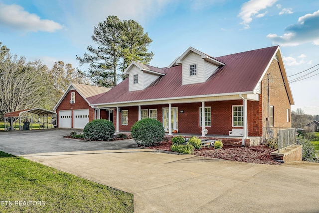 cape cod-style house featuring a carport, a porch, and a garage