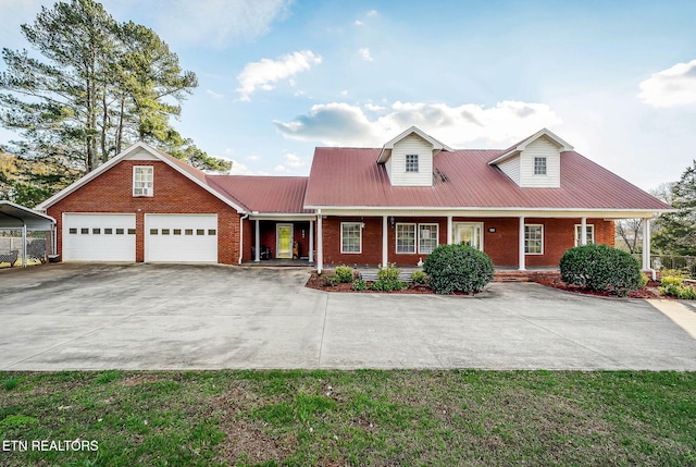 cape cod home featuring a carport and a porch