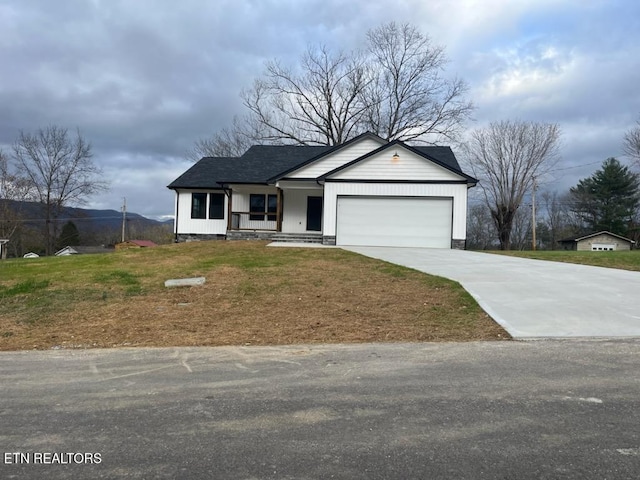 view of front of home featuring a garage and a front lawn