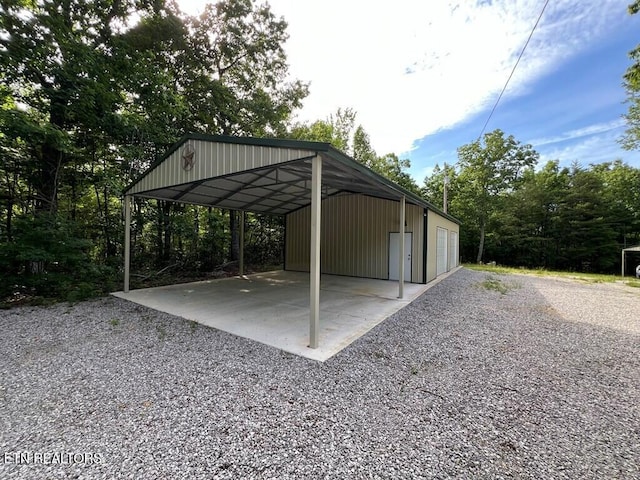 view of parking / parking lot featuring a carport