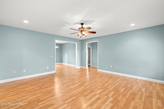 spare room featuring ceiling fan and light hardwood / wood-style floors