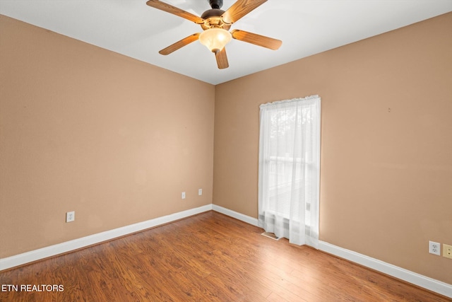 unfurnished room with ceiling fan and wood-type flooring