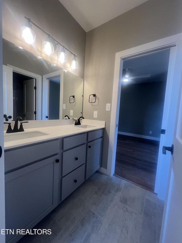 bathroom featuring double vanity and a sink