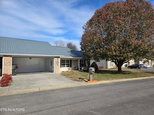 view of front facade with a front lawn and a garage