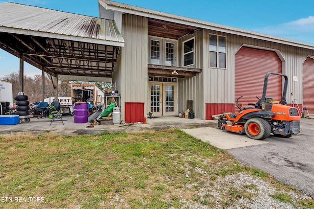 rear view of property with a yard and french doors