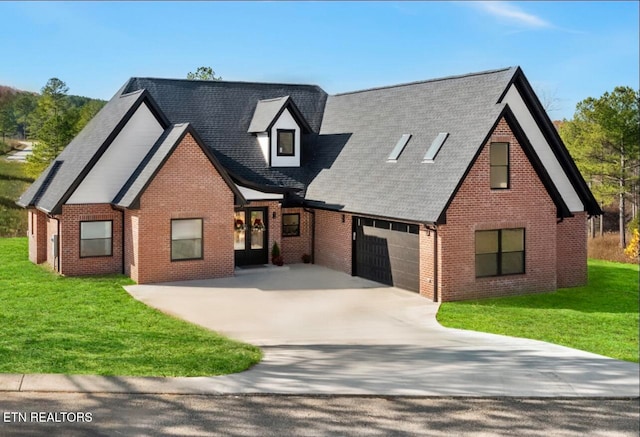 view of front of home with a front lawn and a garage