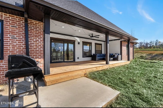 back of property with ceiling fan and an outdoor hangout area