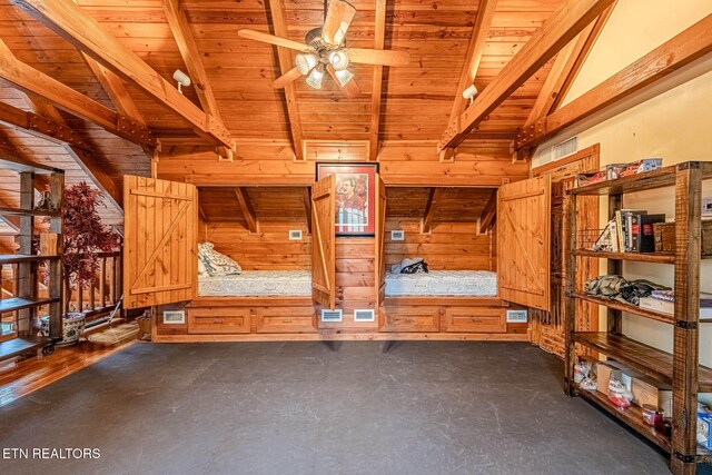 interior space featuring wooden ceiling, lofted ceiling with beams, and wood walls