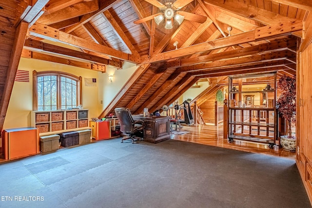 unfurnished office featuring hardwood / wood-style floors, vaulted ceiling with beams, ceiling fan, and wood ceiling