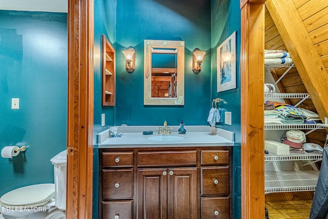 bathroom with vanity and toilet