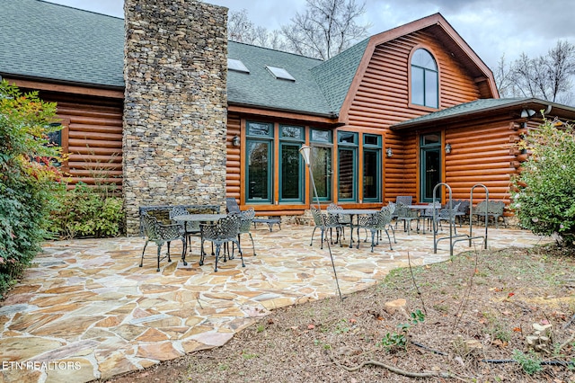 rear view of property with a patio area