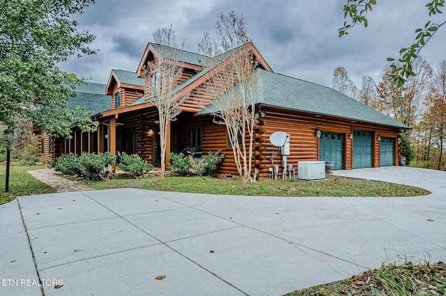 cabin featuring a garage