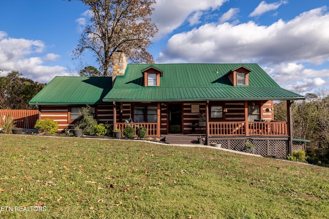 log cabin featuring a porch and a front lawn