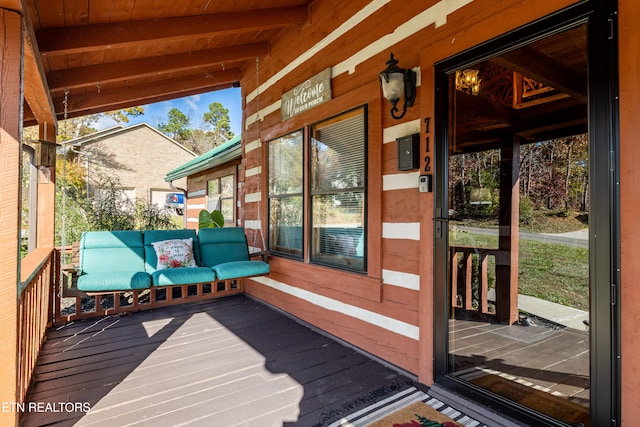 wooden terrace featuring a porch