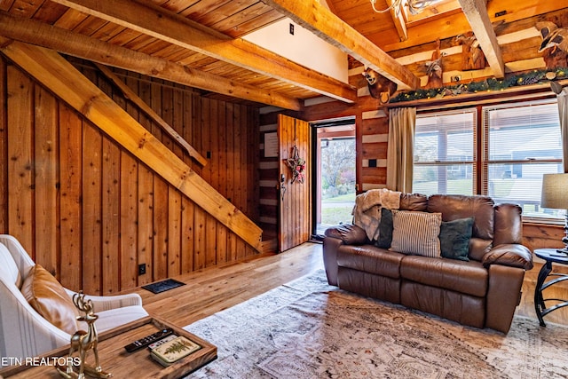 living room with beam ceiling, wood walls, wooden ceiling, and hardwood / wood-style flooring