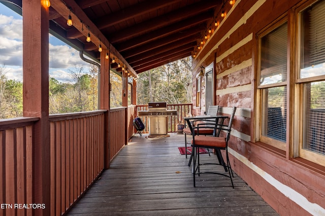 wooden deck featuring covered porch