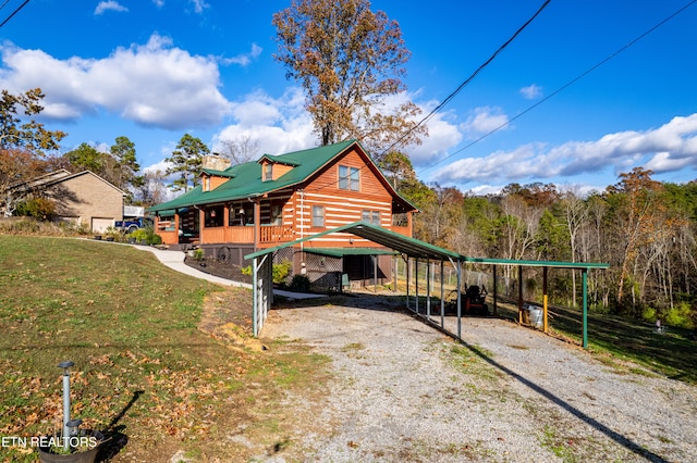 view of home's exterior featuring a yard and a carport